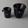 Black pot with a lid and the VDP.Adler in white.